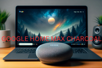 Google Home Max Charcoal next to a laptop.