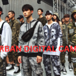 Fashion-forward individuals wearing urban digital camo clothing at a streetwear fashion event.